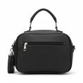 Bolso negro Y2K con corazón alado y detalles metálicos