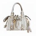 Bolso Y2K con corazón y detalles dorados disponible en negro y beige
